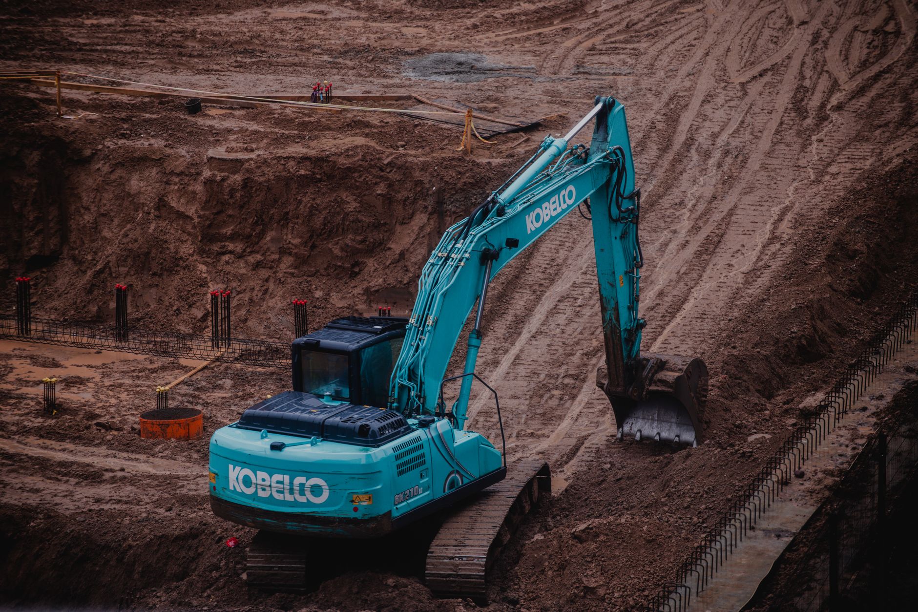 Excavator moving earth on a Central Florida site development project